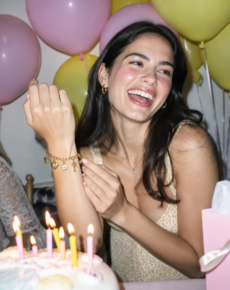 Birthday guest laughing with charm bracelet